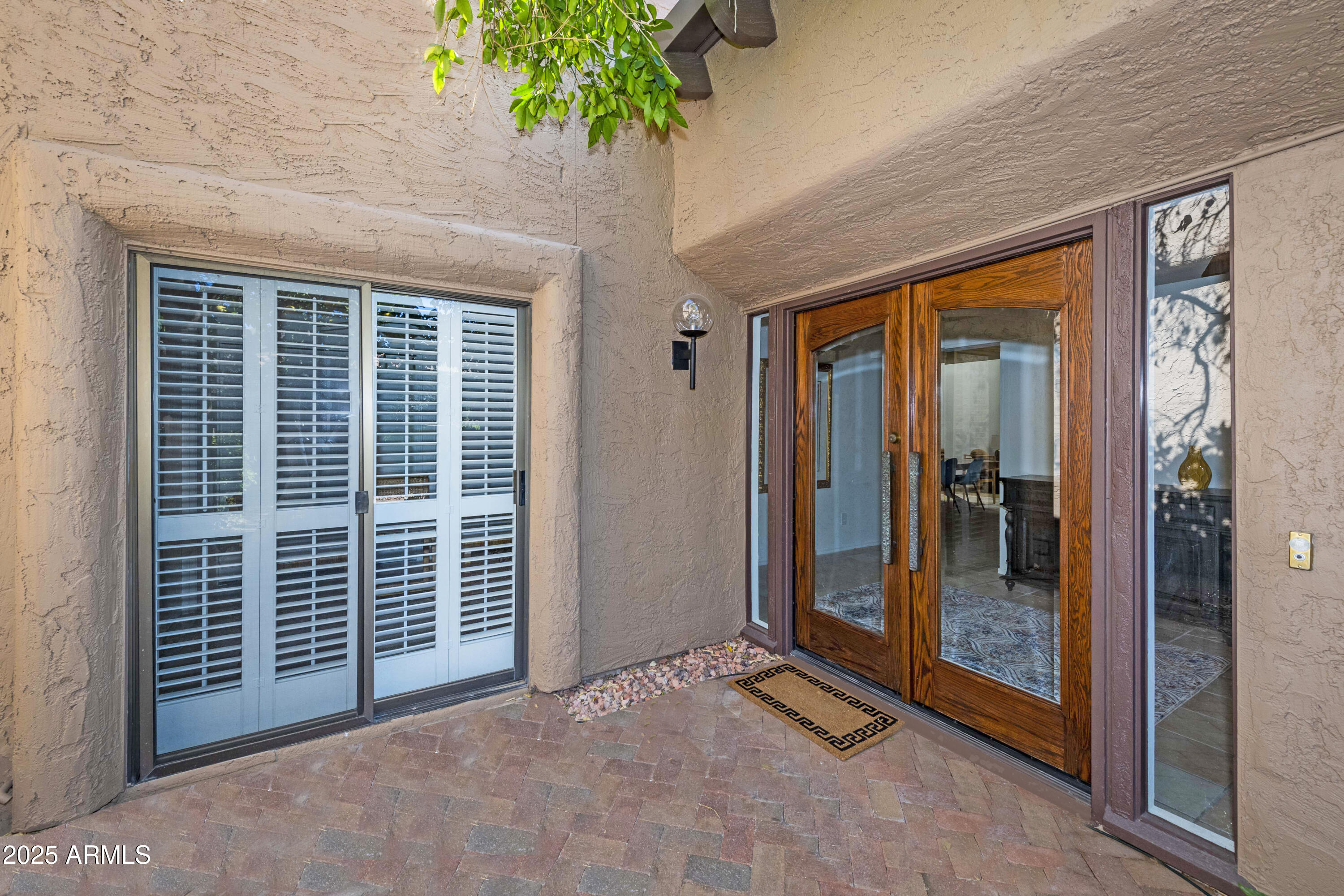 4446 East Camelback Road, Unit 109 Phoenix, AZ 85018 - Photo 6 of 42 a view of an entryway with a door