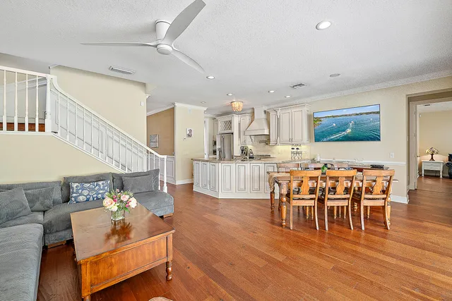 a view of a dining room with furniture wooden floor and chandelier