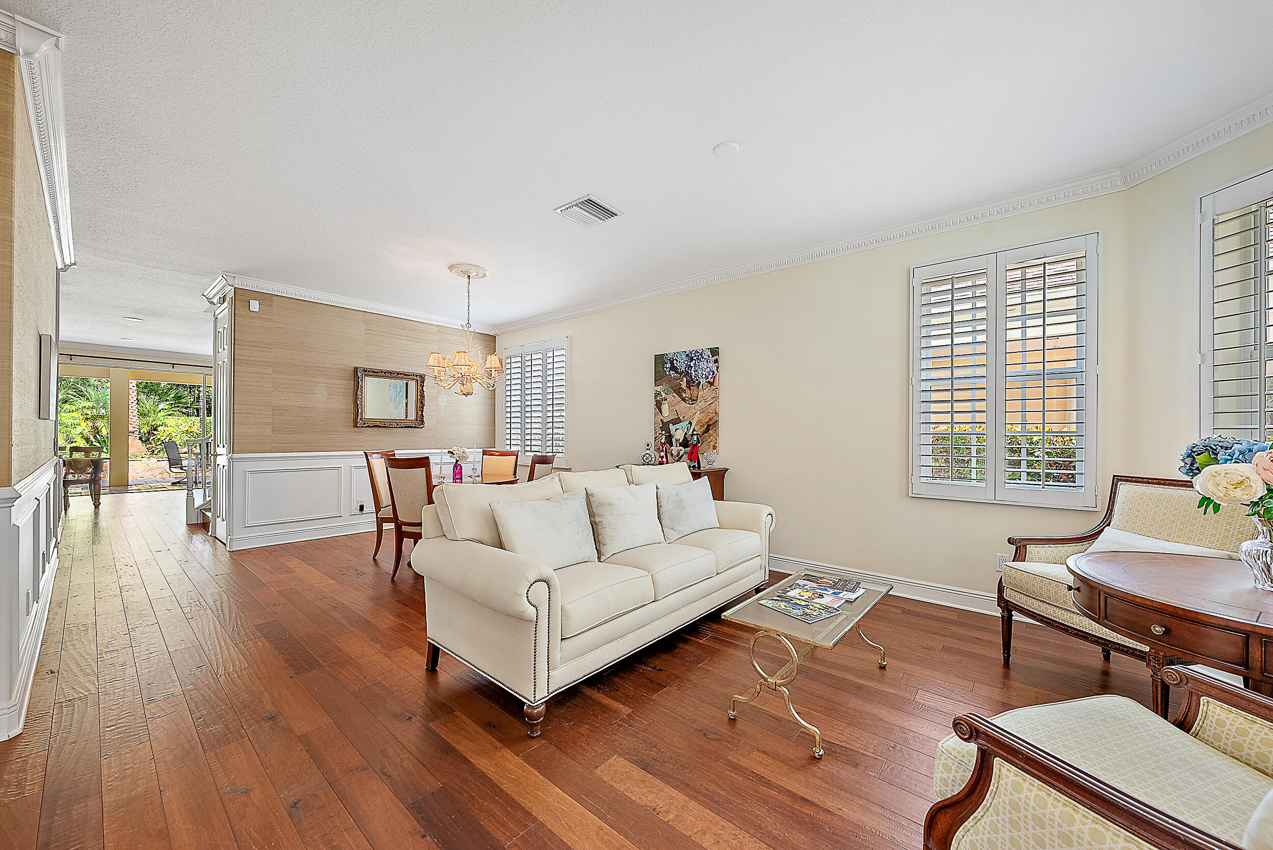 140 Sweet Bay Circle Jupiter, FL 33458 - Photo 19 of 36 a living room with furniture and a wooden floor