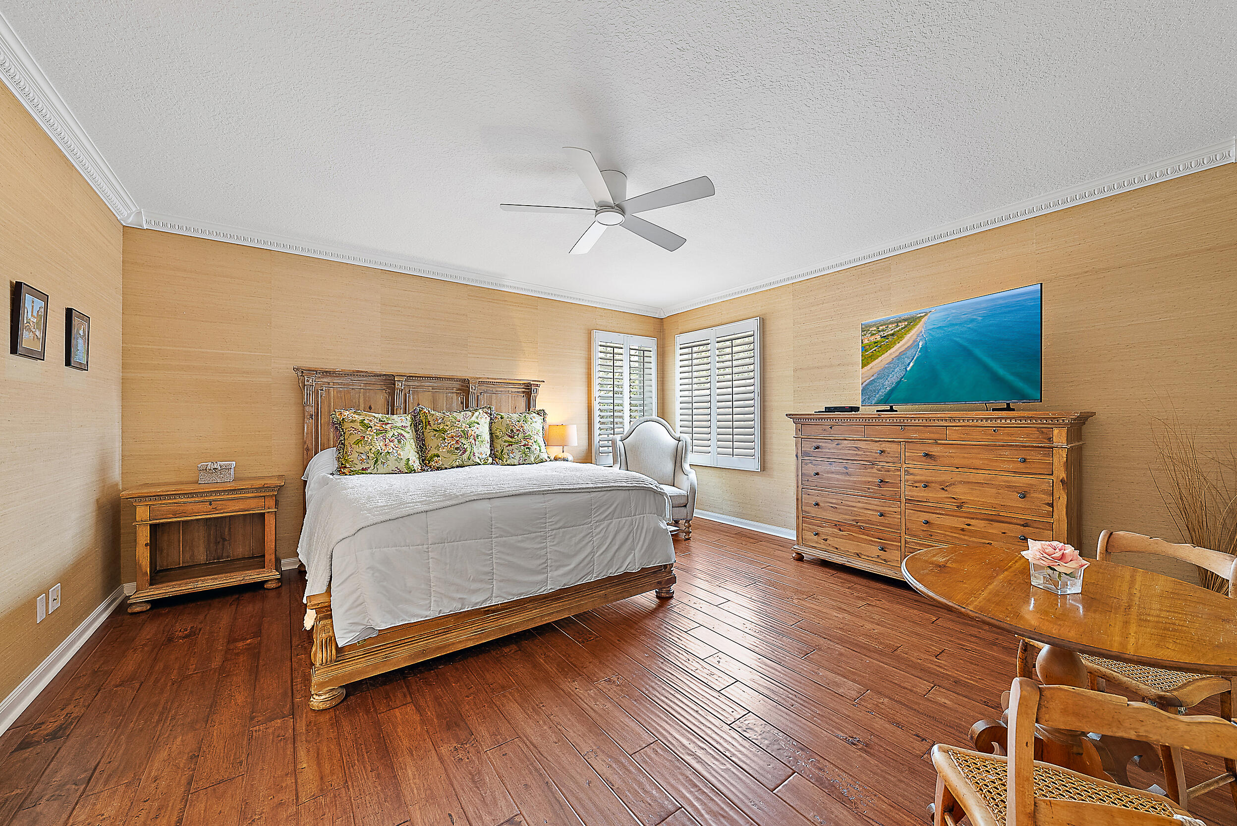 140 Sweet Bay Circle Jupiter, FL 33458 - Photo 22 of 36 a bedroom with a bed and wooden floor