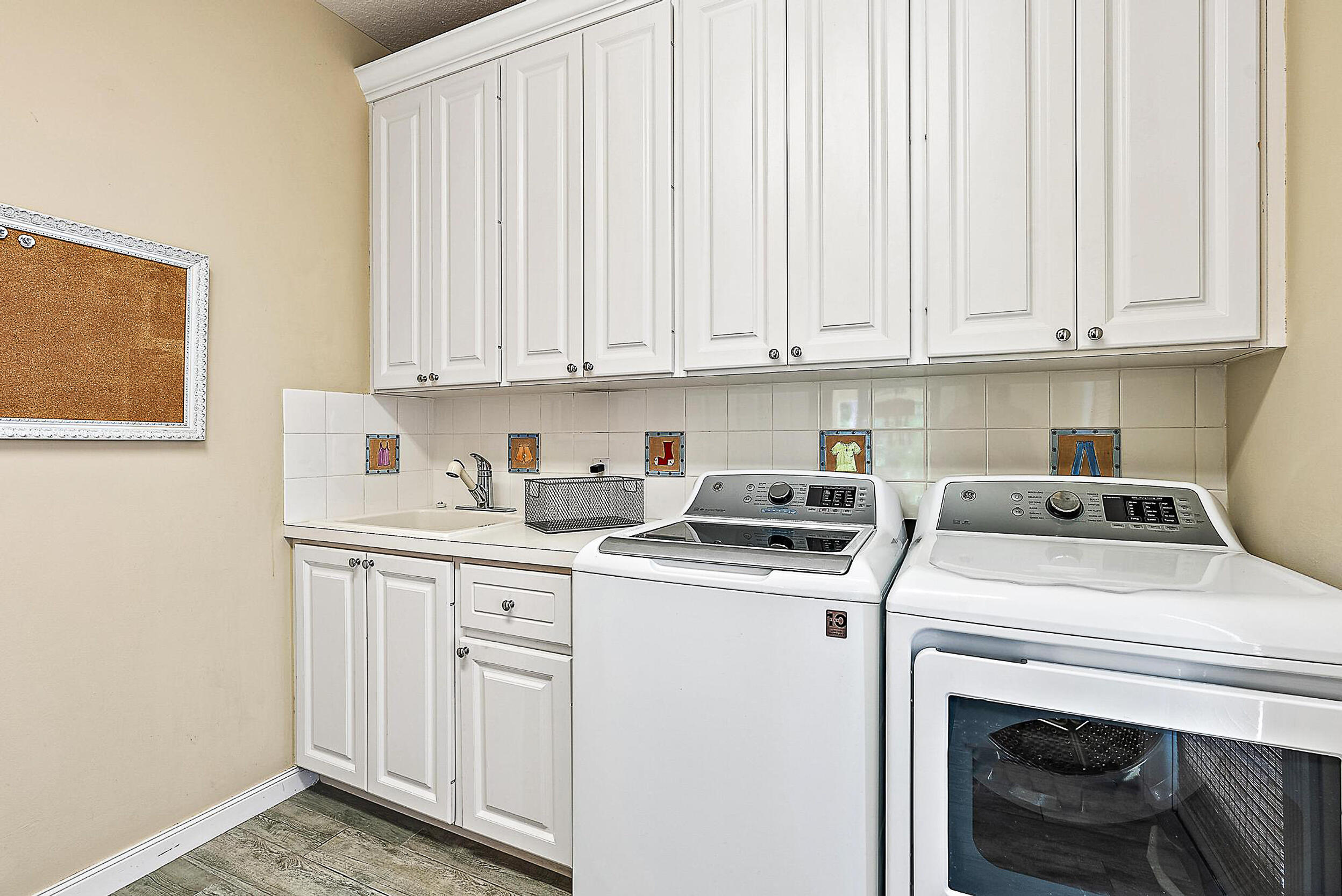 140 Sweet Bay Circle Jupiter, FL 33458 - Photo 25 of 36 a utility room with dryer and washer