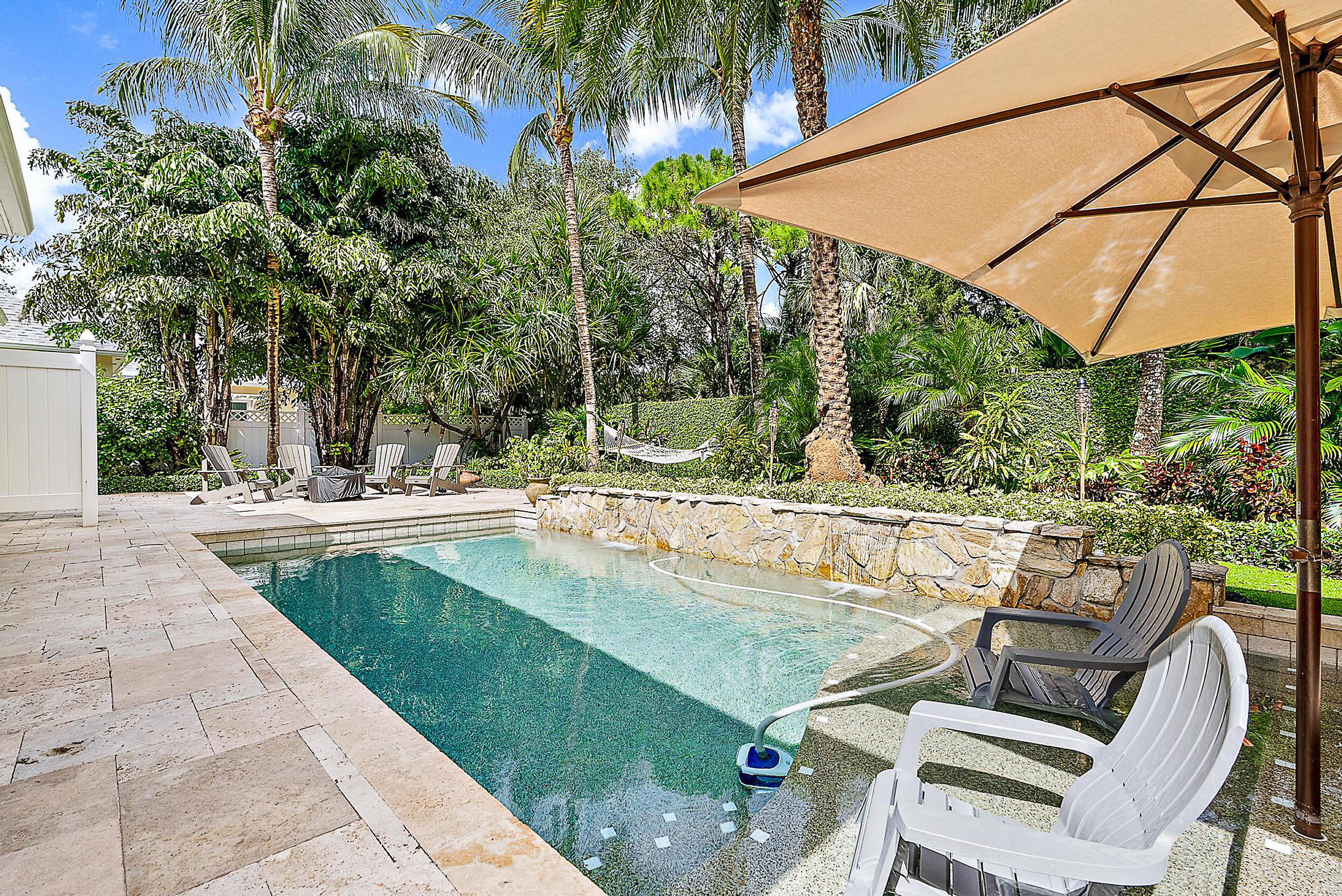 140 Sweet Bay Circle Jupiter, FL 33458 - Photo 33 of 36 a view of swimming pool with a patio