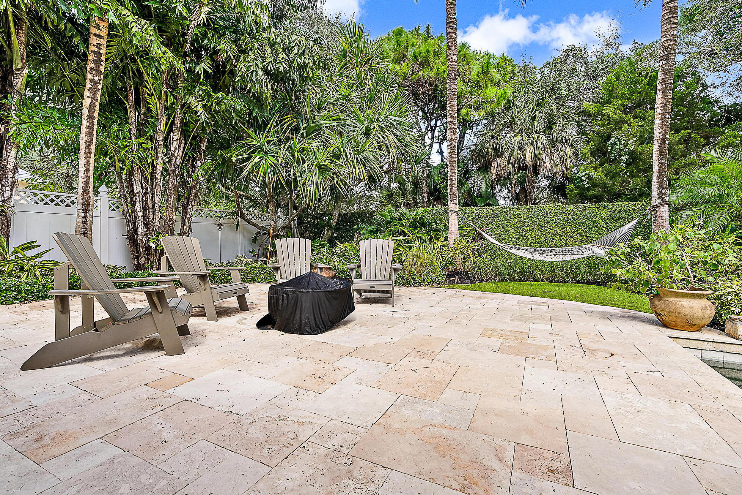 140 Sweet Bay Circle Jupiter, FL 33458 - Photo 34 of 36 a view of a backyard with sitting area