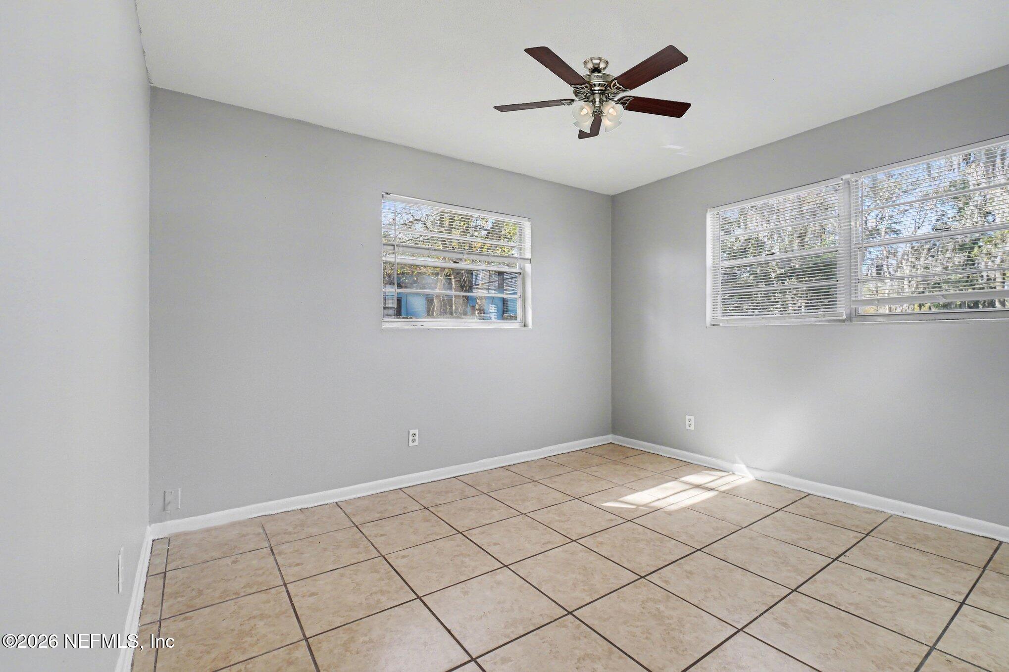 4852 Hatteras Road Jacksonville, FL 32208 - Photo 12 of 15 a view of an empty room and window