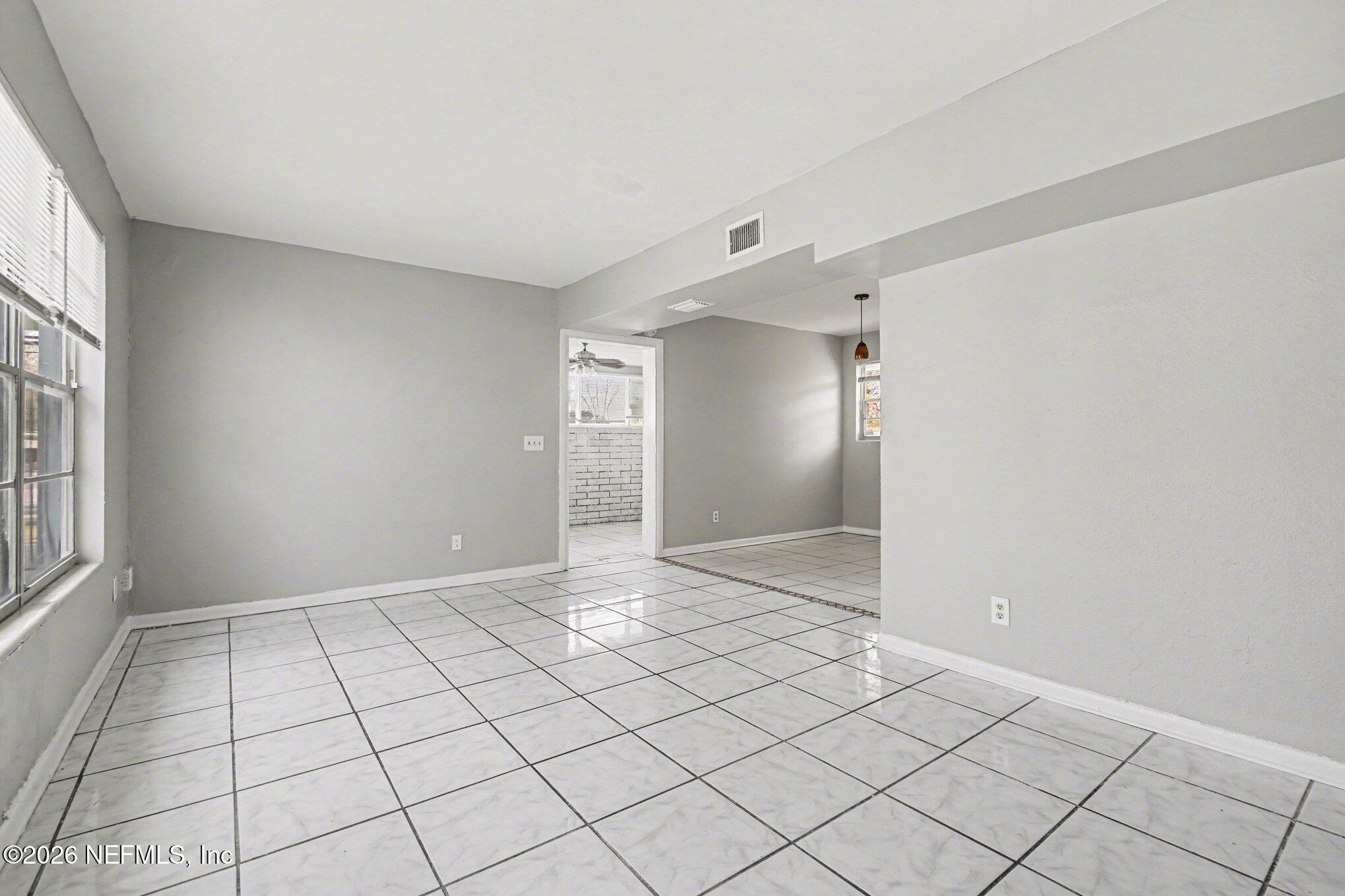 4852 Hatteras Road Jacksonville, FL 32208 - Photo 3 of 15 a view of an empty room and window