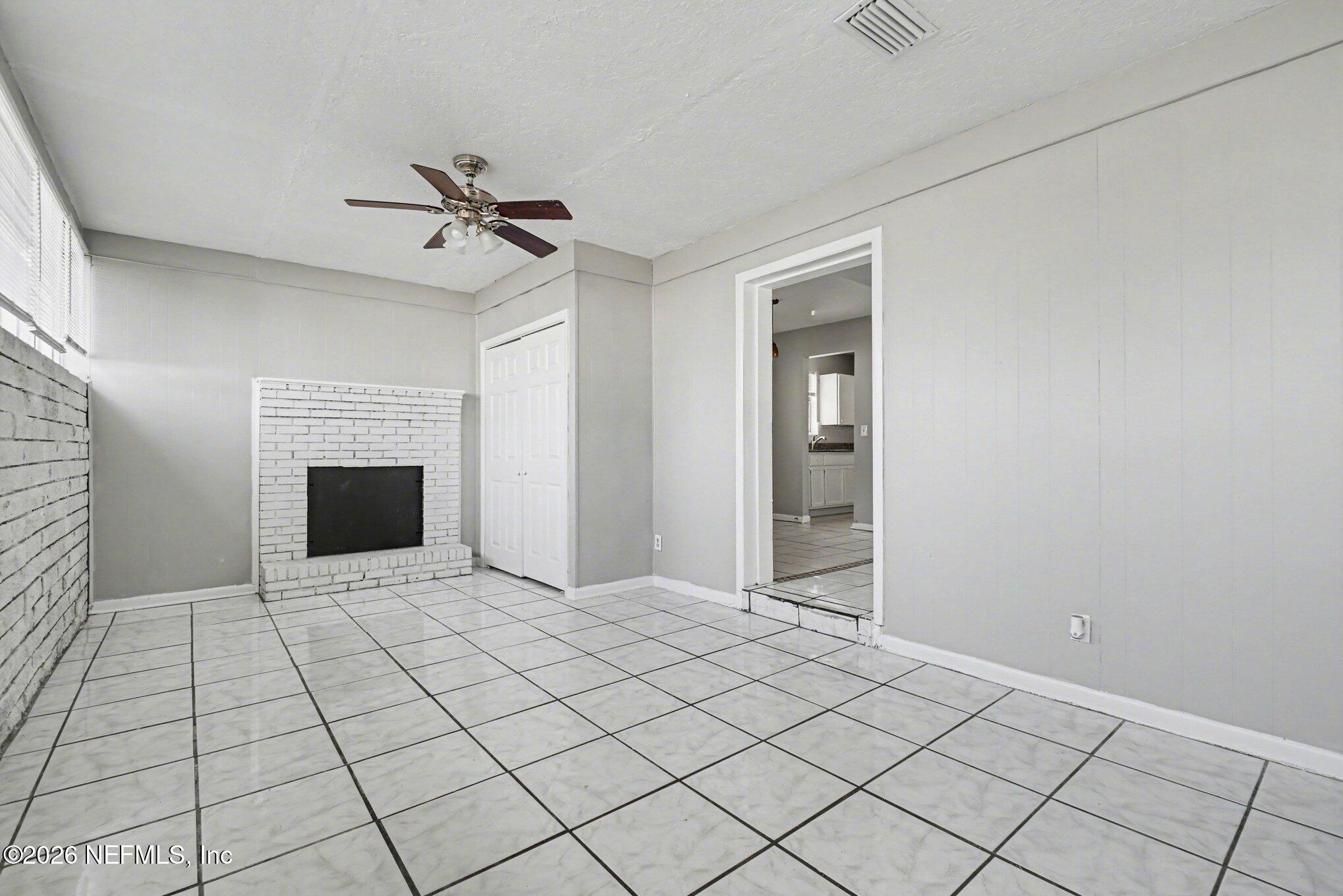 4852 Hatteras Road Jacksonville, FL 32208 - Photo 4 of 15 a view of empty room with fireplace