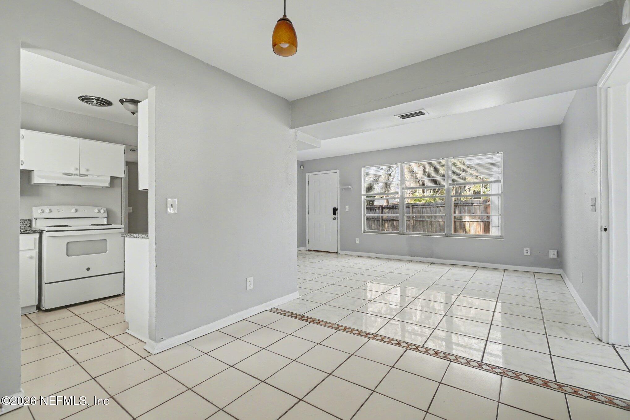 4852 Hatteras Road Jacksonville, FL 32208 - Photo 6 of 15 a view of an empty room with a stove