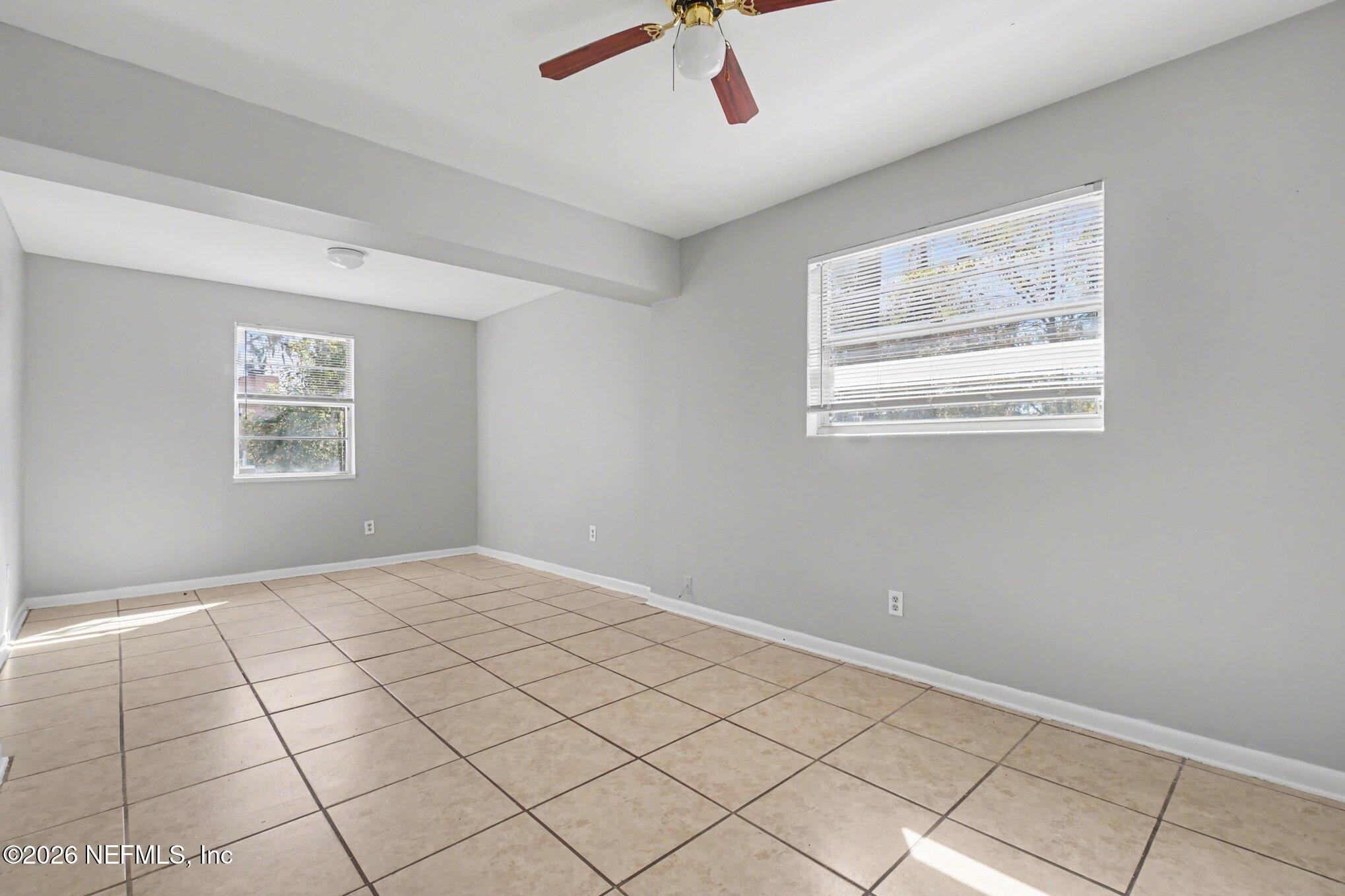 4852 Hatteras Road Jacksonville, FL 32208 - Photo 10 of 15 a view of an empty room and window