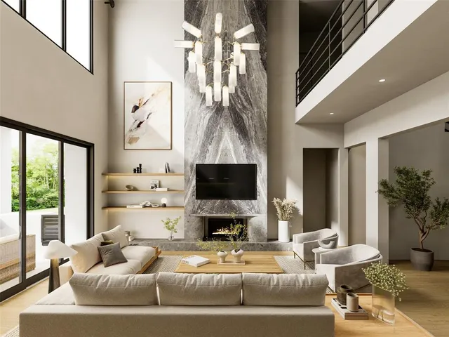 a living room with fireplace furniture and a large window