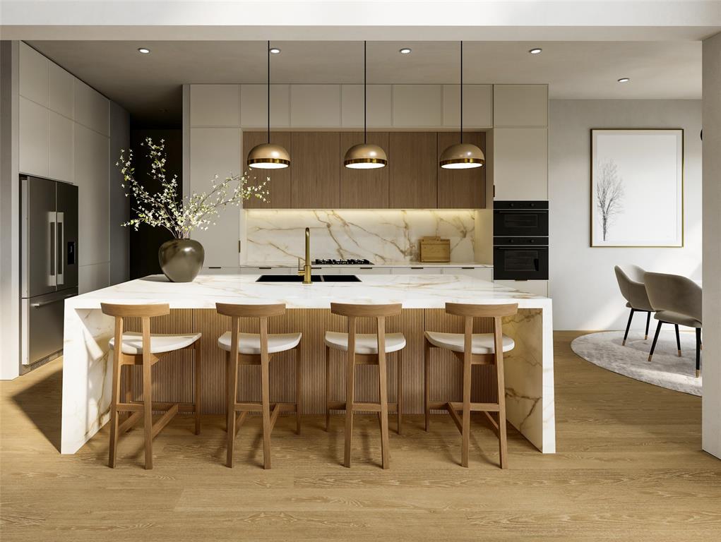 3135 Walnut Hill Lane Dallas, TX 75229 - Photo 10 of 12 a kitchen with a table and chairs