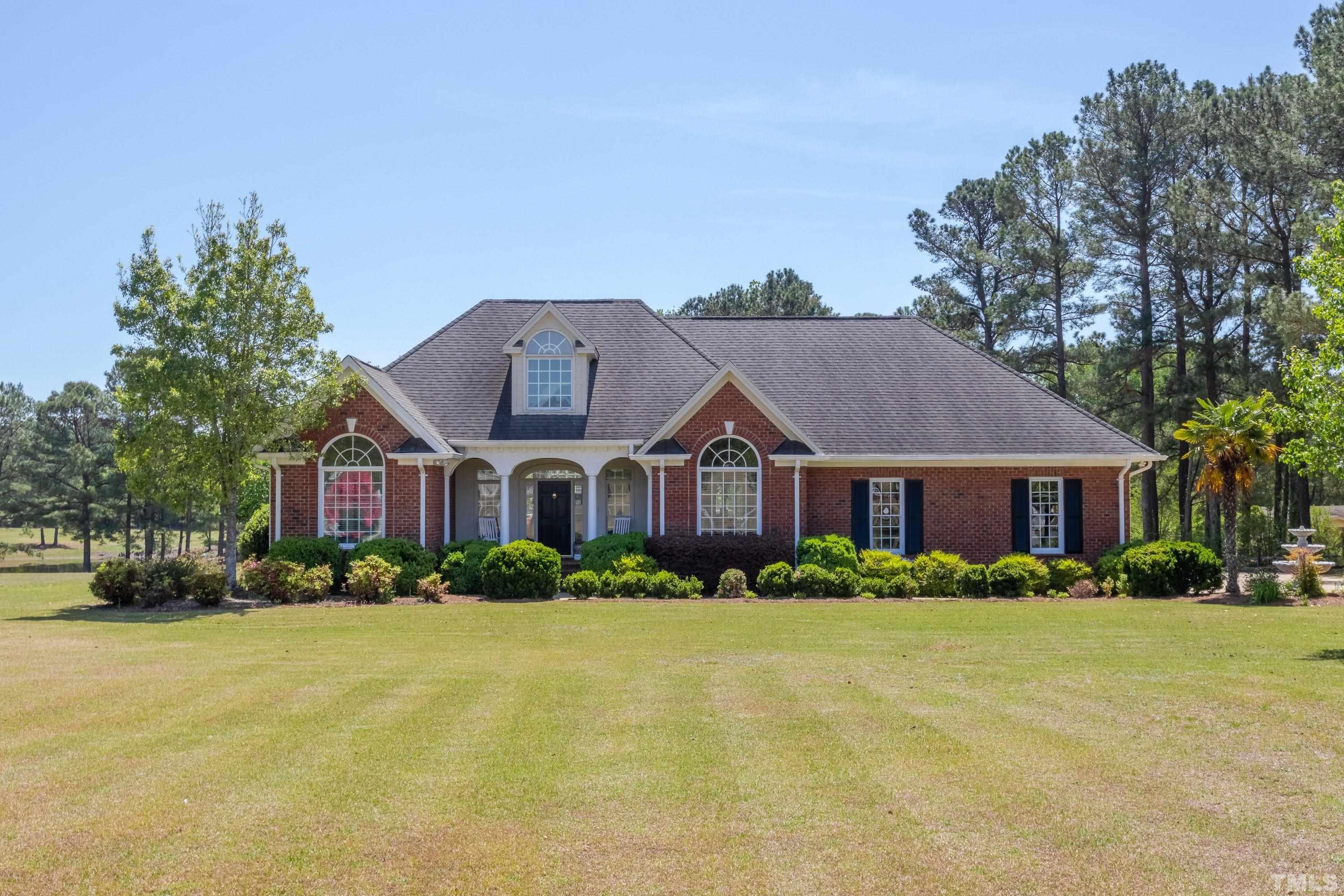 5646 Red Hill Church Road Coats, NC 27521 - Photo 1 of 31 front view of house with a yard
