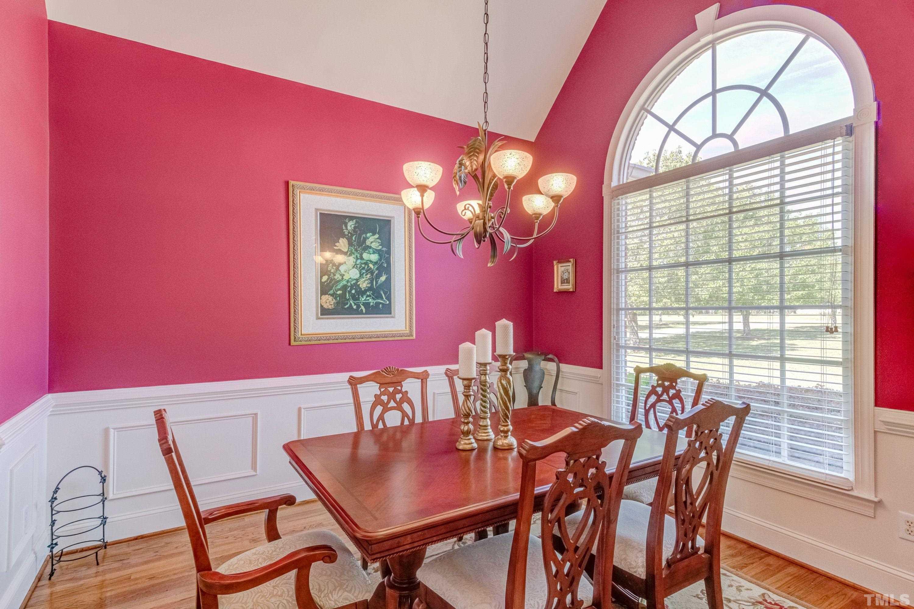 5646 Red Hill Church Road Coats, NC 27521 - Photo 14 of 31 a view of a dining room with furniture a chandelier and wooden floor