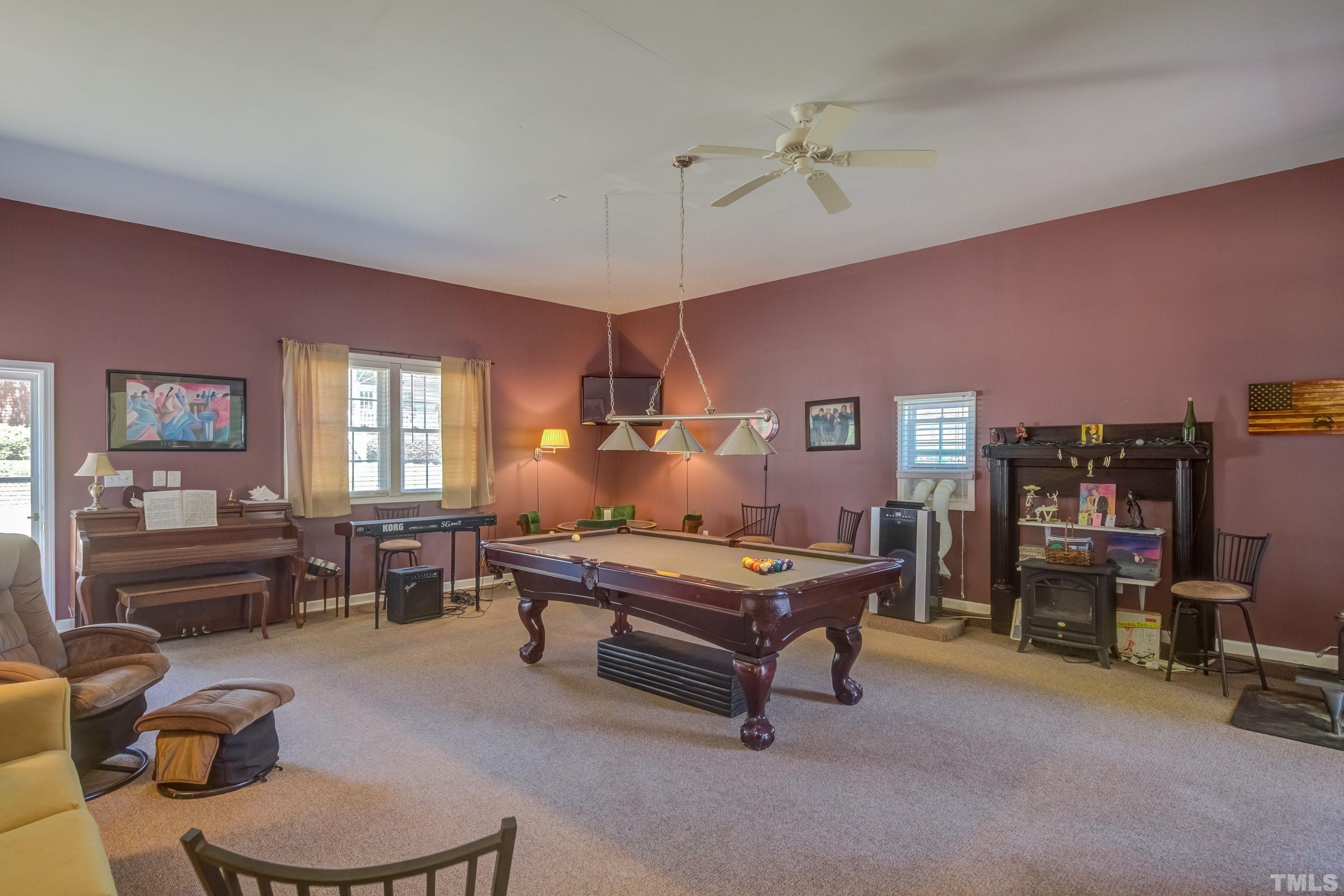 5646 Red Hill Church Road Coats, NC 27521 - Photo 18 of 31 a living room with furniture and wooden floor