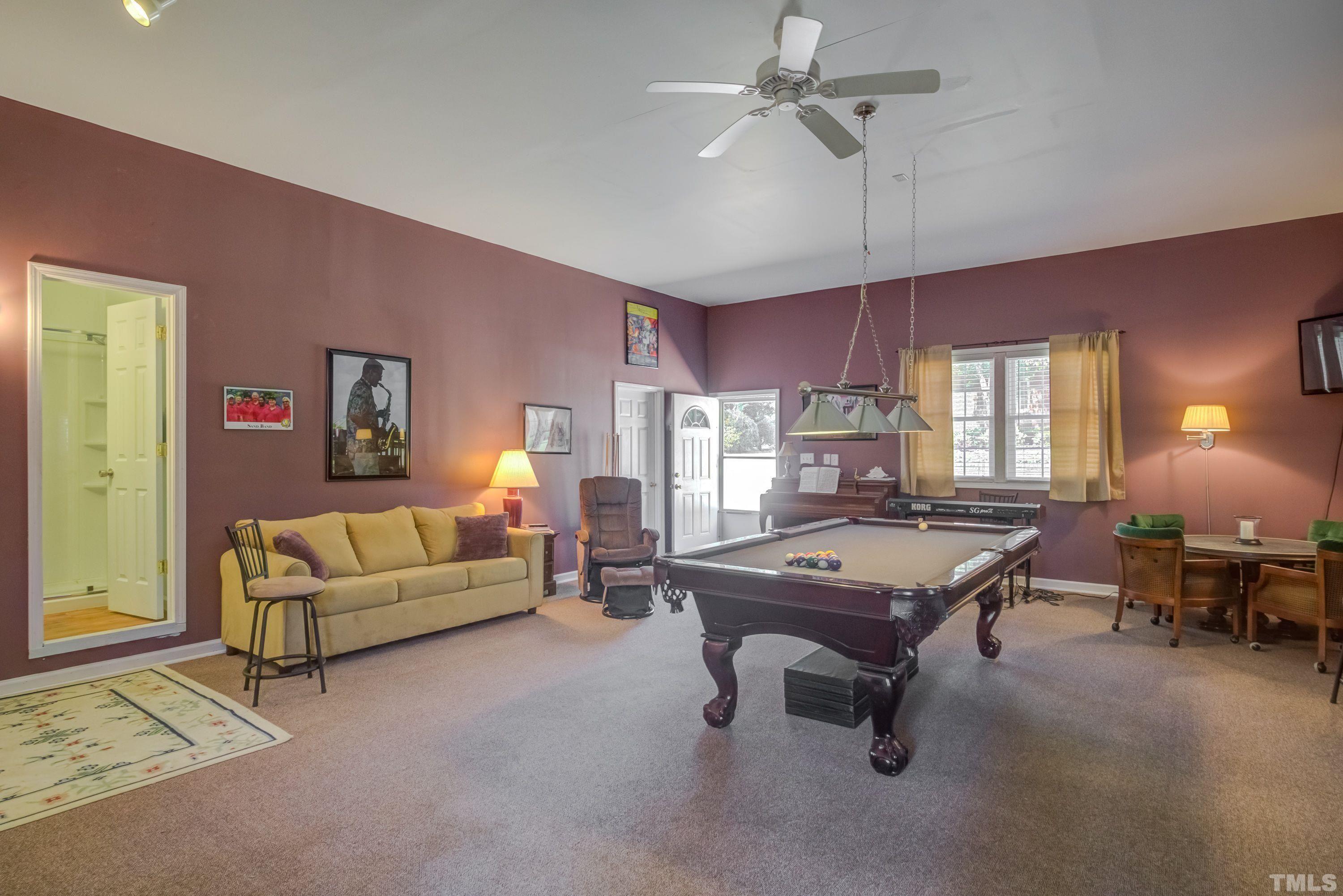 5646 Red Hill Church Road Coats, NC 27521 - Photo 19 of 31 a living room with furniture pool table and a window
