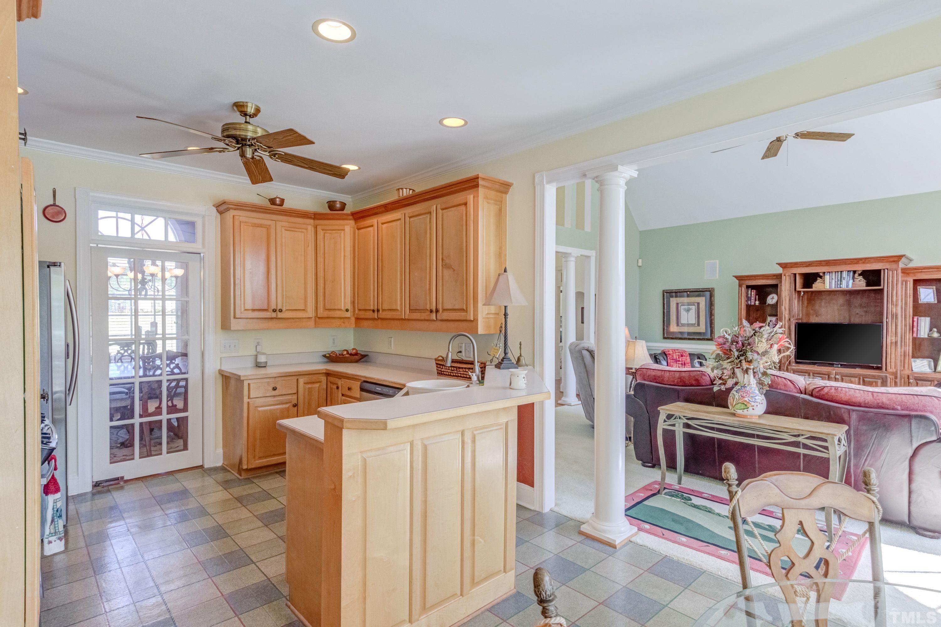 5646 Red Hill Church Road Coats, NC 27521 - Photo 23 of 31 a kitchen that has a lot of cabinets in it and a window
