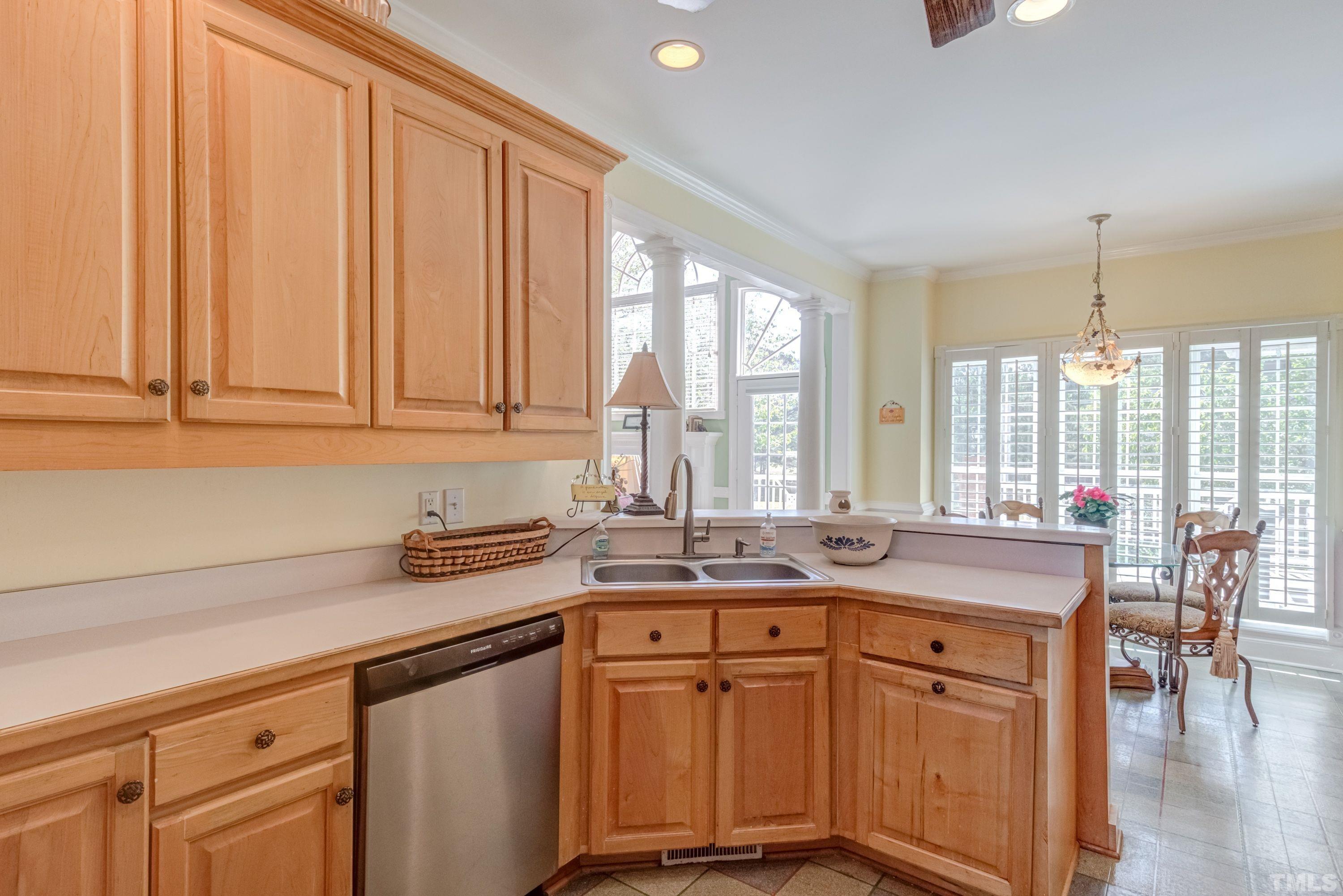 5646 Red Hill Church Road Coats, NC 27521 - Photo 25 of 31 a kitchen with stainless steel appliances granite countertop a sink a stove and cabinets