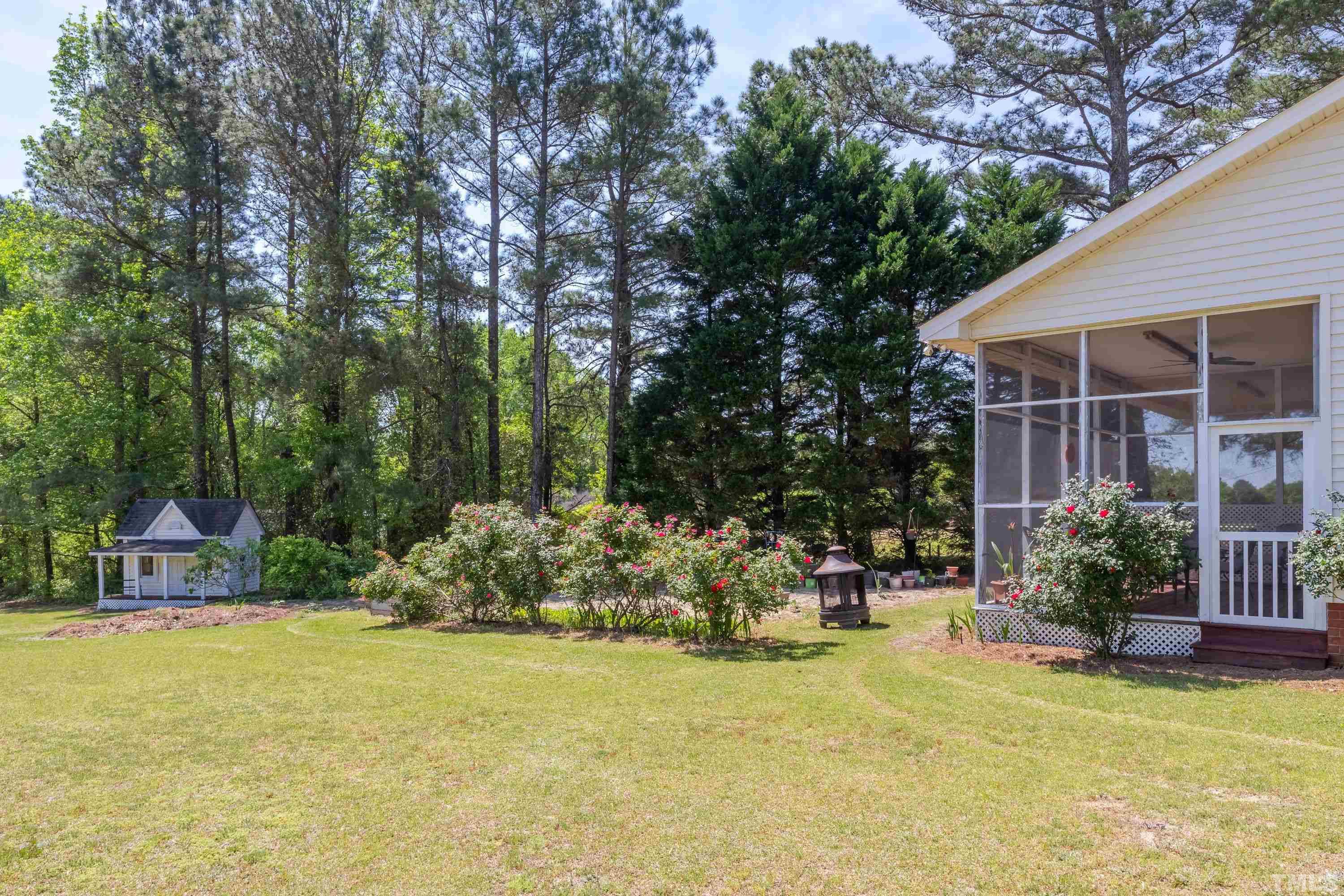 5646 Red Hill Church Road Coats, NC 27521 - Photo 27 of 31 a view of swimming pool with outdoor seating and plants