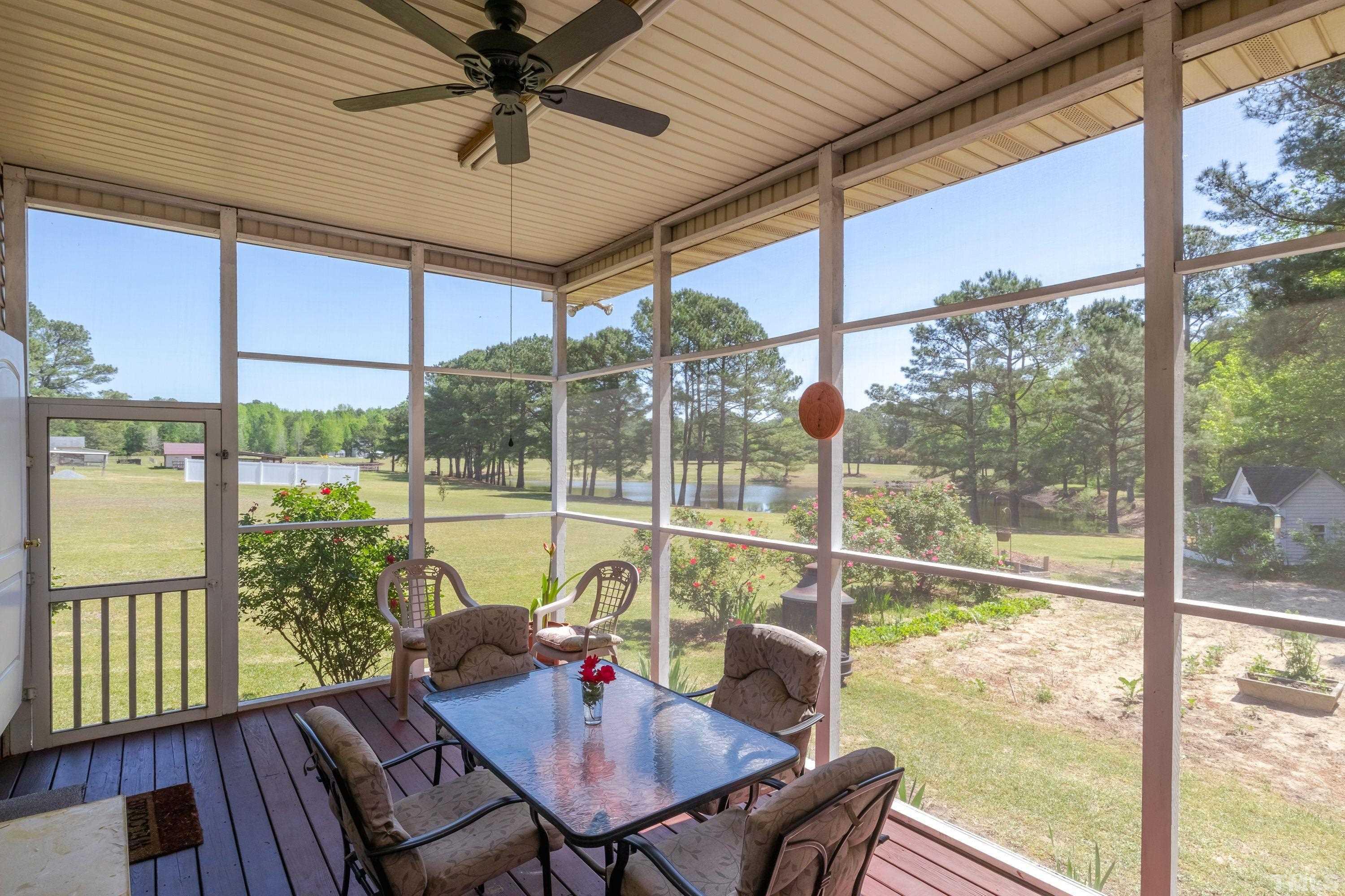 5646 Red Hill Church Road Coats, NC 27521 - Photo 29 of 31 a view of a dining room with furniture window and outside view