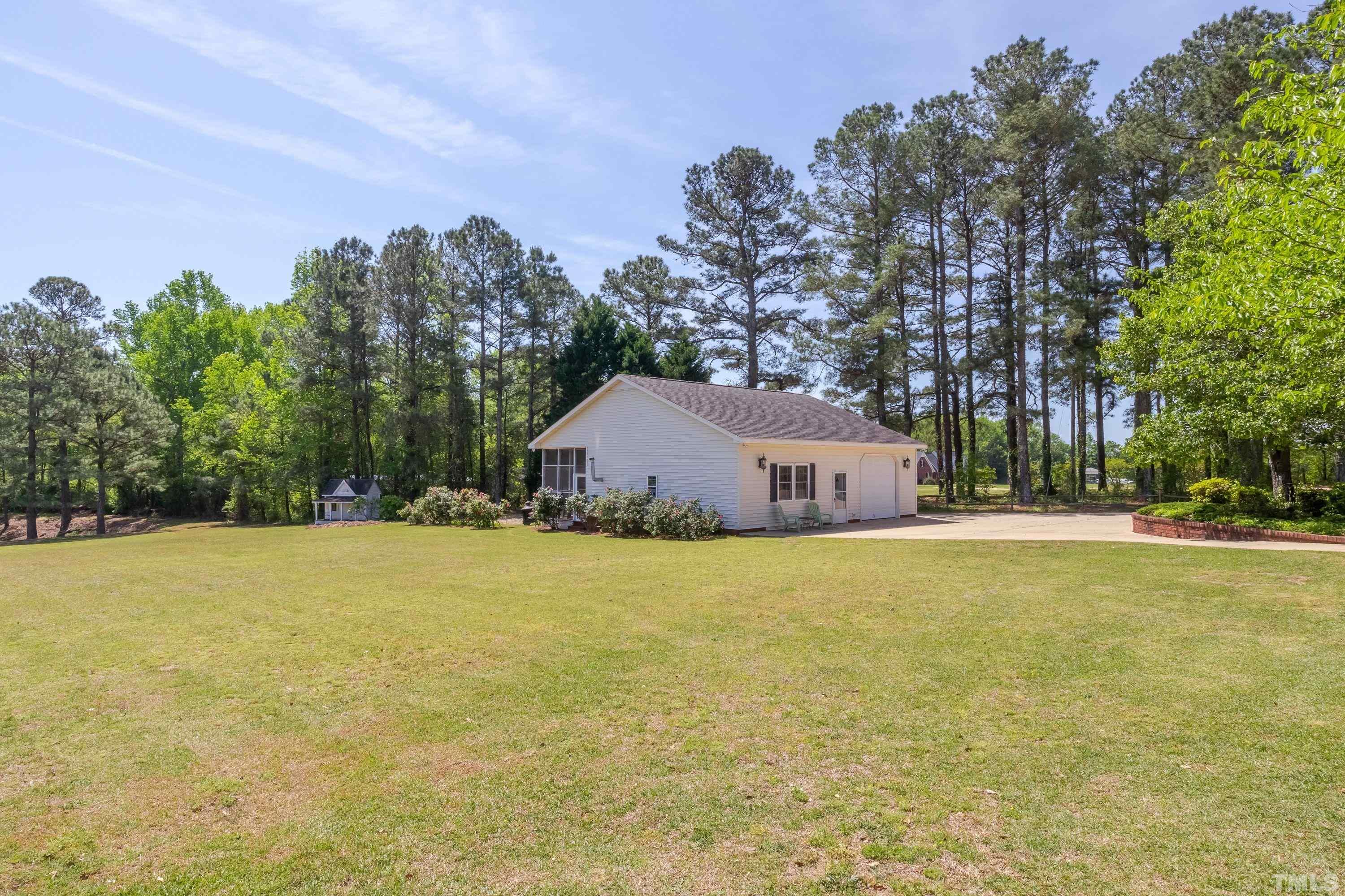 5646 Red Hill Church Road Coats, NC 27521 - Photo 3 of 31 a front view of house with yard and trees