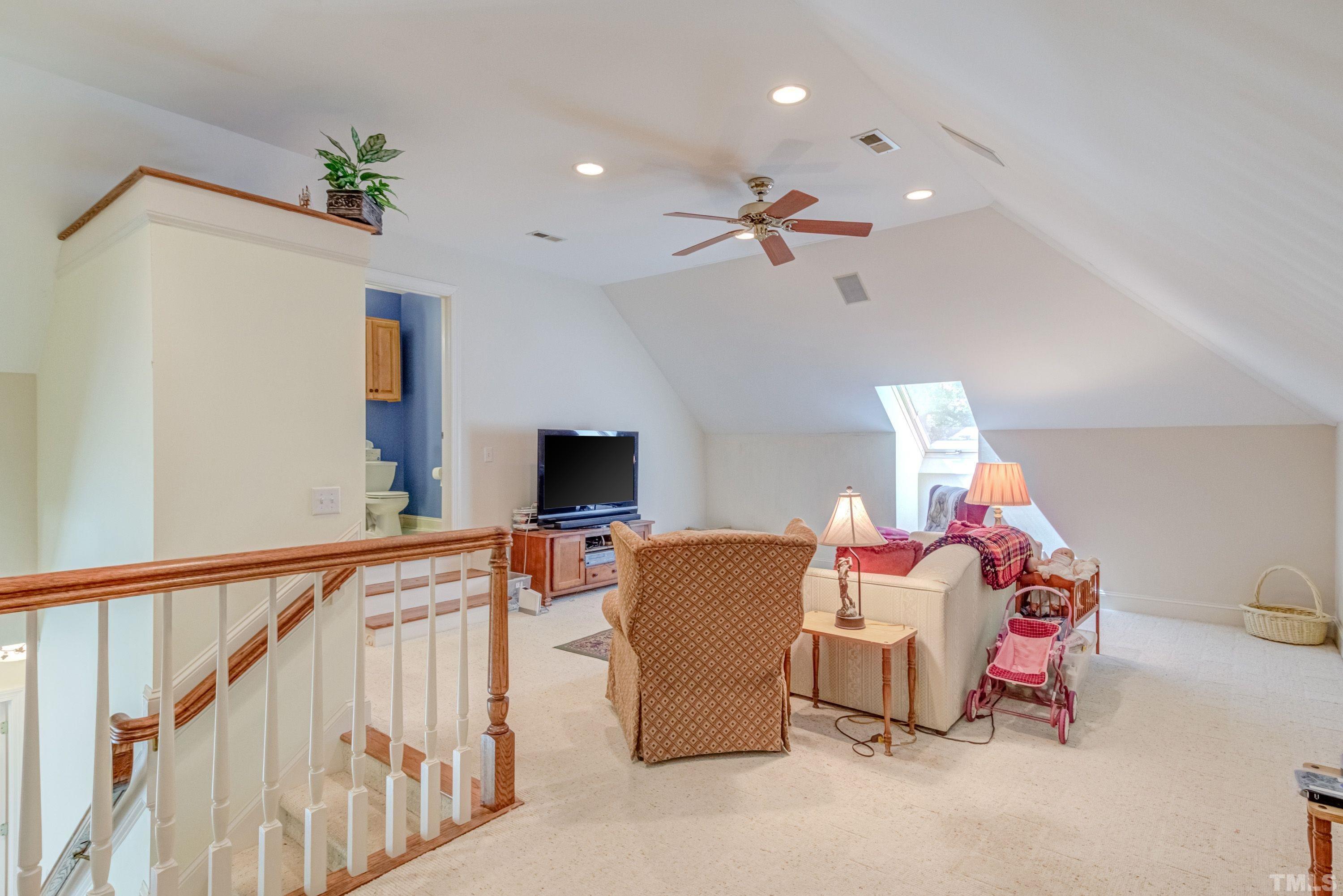 5646 Red Hill Church Road Coats, NC 27521 - Photo 10 of 31 a living room with furniture and a flat screen tv
