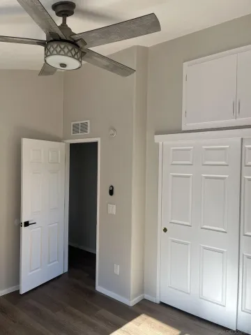 a view of a room with wooden floor
