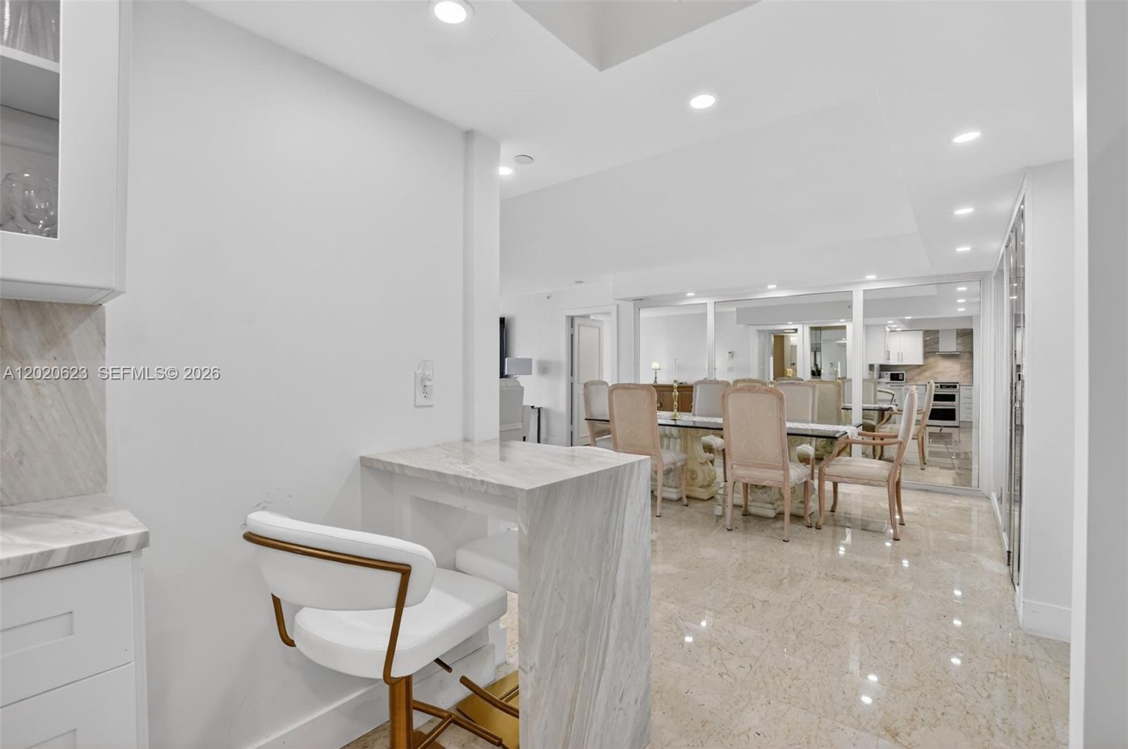 4101 North Ocean Boulevard, Unit 1605 Boca Raton, FL 33431 - Photo 7 of 35 a living room with furniture a dining table and chairs