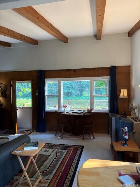 205 Long Flats Road East Branch, NY 13756 - Photo 5 of 14 a living room with a couch a large window and a table