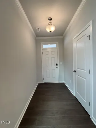 an empty room with a empty space and windows