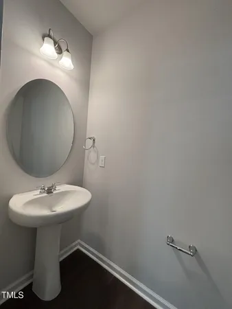 a spacious bathroom with a double vanity sink and a mirror