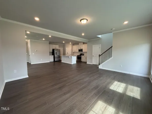 a view of kitchen with cabinets and wooden floor