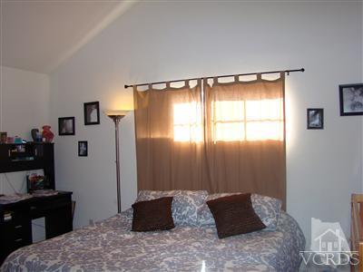 464 West Wooley Road Oxnard, CA 93030 - Photo 4 of 10 a bedroom with a bed and a window