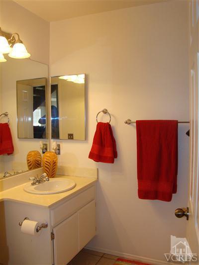 464 West Wooley Road Oxnard, CA 93030 - Photo 5 of 10 a bathroom with a sink and a mirror
