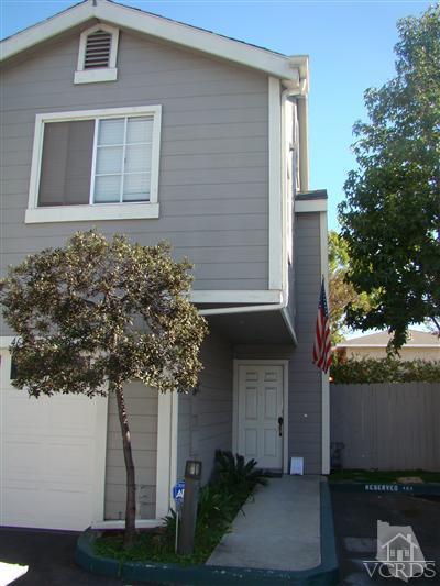 464 West Wooley Road Oxnard, CA 93030 - Photo 7 of 10 a house that has a tree in front of the house