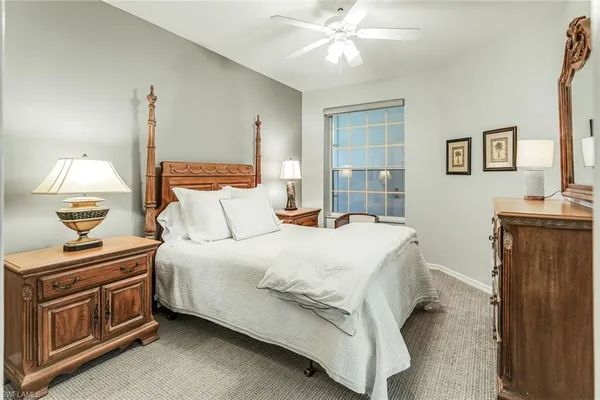 a bedroom with a bed and dresser