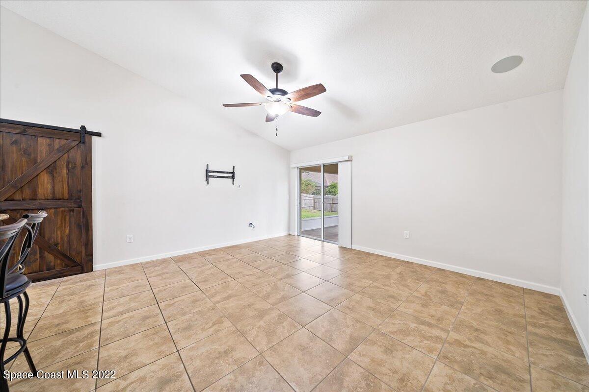 6175 Adina Road Cocoa, FL 32927 - Photo 15 of 29 a view of a livingroom with a flat screen tv