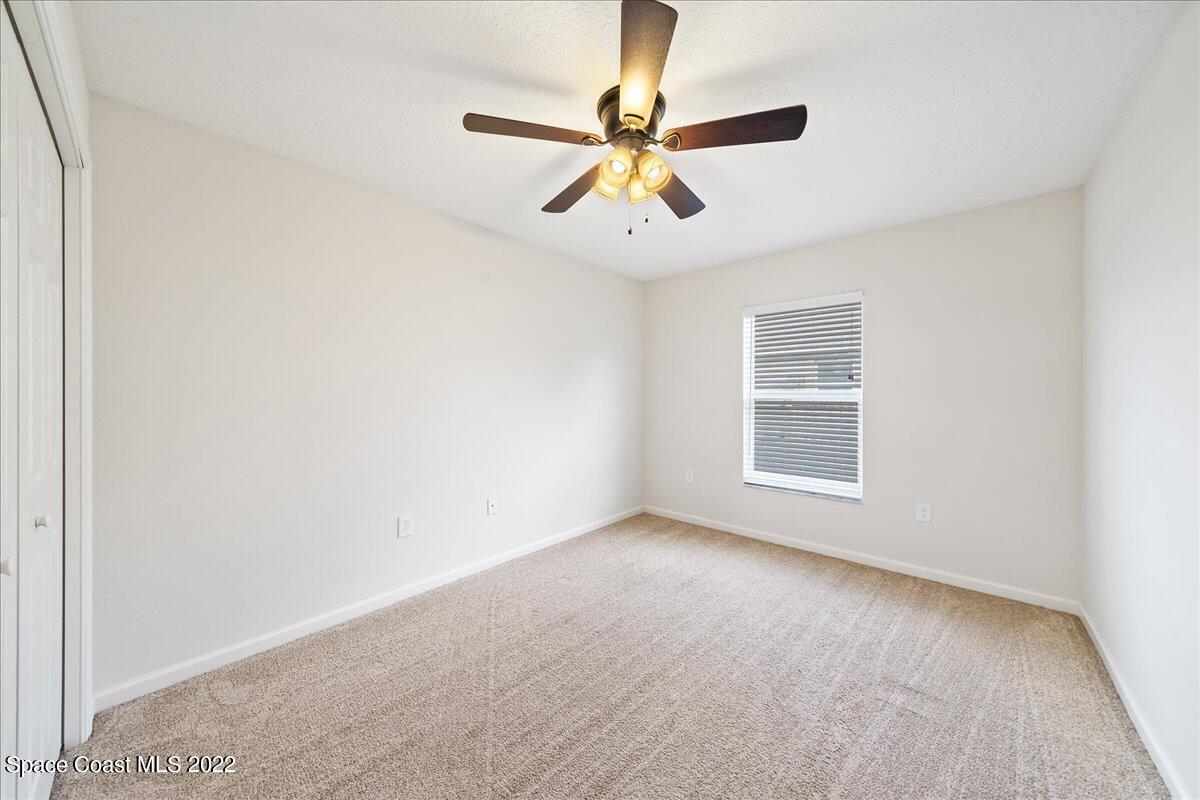6175 Adina Road Cocoa, FL 32927 - Photo 20 of 29 a view of an empty room with a window