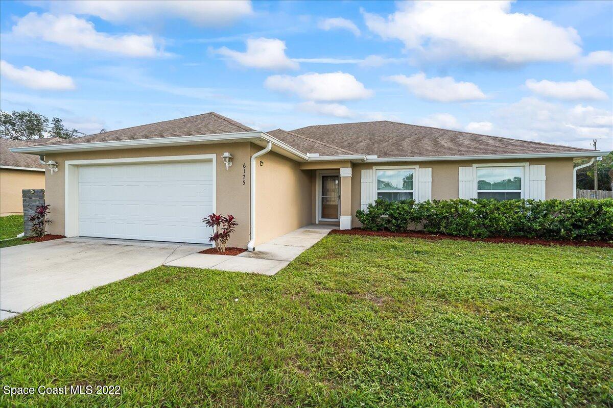 6175 Adina Road Cocoa, FL 32927 - Photo 2 of 29 a view of a house with backyard and garden