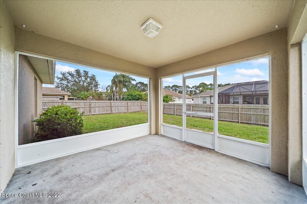 6175 Adina Road Cocoa, FL 32927 - Photo 25 of 29 a view of a garden with an outdoor seating