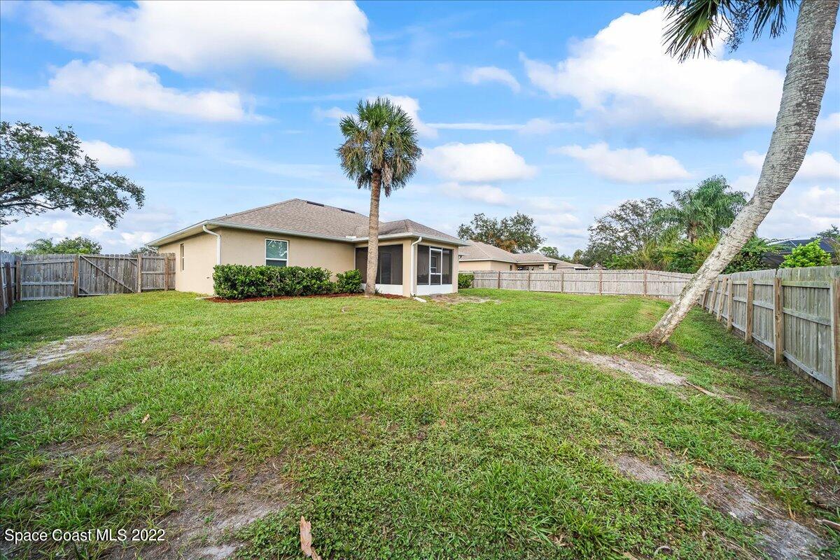 6175 Adina Road Cocoa, FL 32927 - Photo 28 of 29 a front view of house with yard and green space