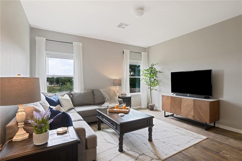 15117 Diamondleaf Cove Austin, TX 78724 - Photo 4 of 13 a living room with furniture and a flat screen tv