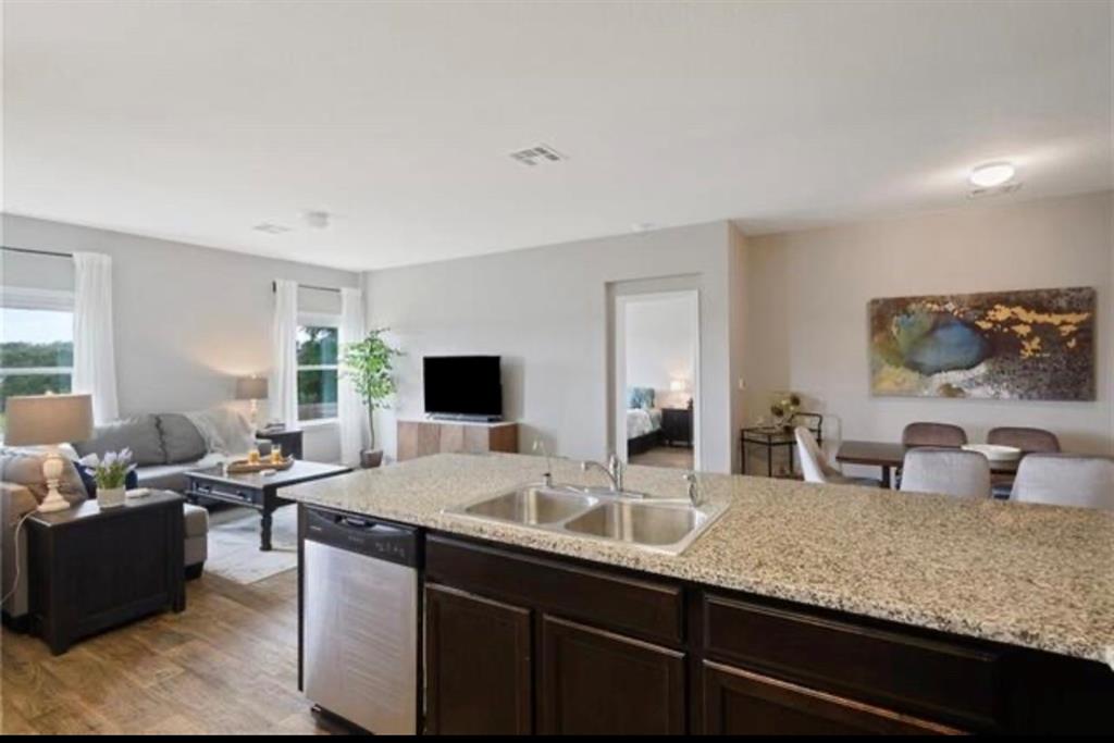 15117 Diamondleaf Cove Austin, TX 78724 - Photo 13 of 13 a living room with granite countertop furniture and a flat screen tv