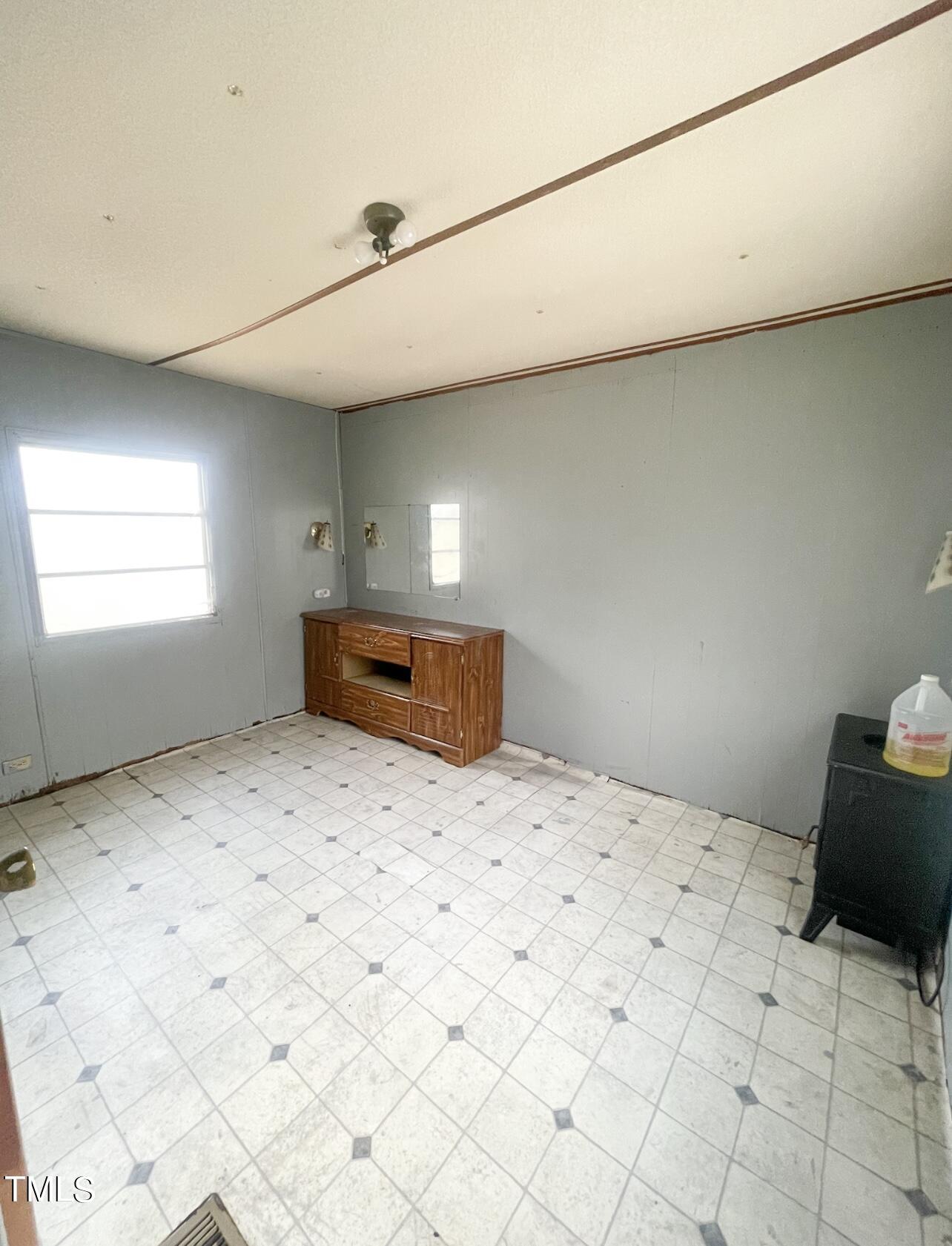 144 Henderson Road Roxboro, NC 27573 - Photo 9 of 11 a bedroom with a bed and a window