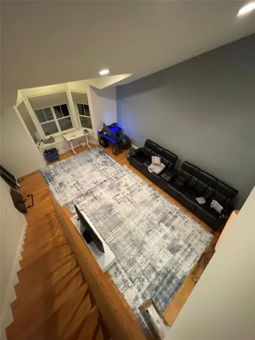 a bed sitting in a room next to a window