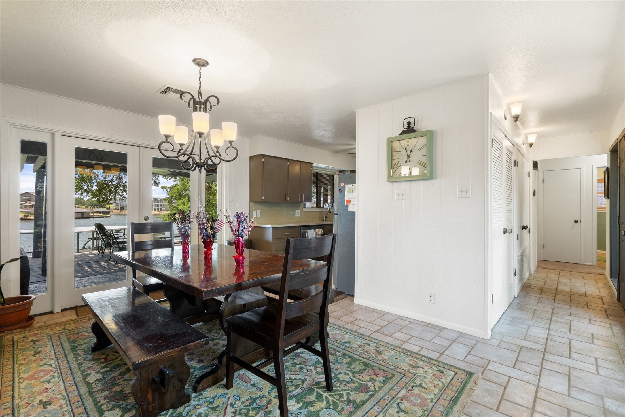 141 Perry Lane Kingsland, TX 78639 - Photo 18 of 40 Step into a charming dining area with seamless access to outdoor living and waterfront views.