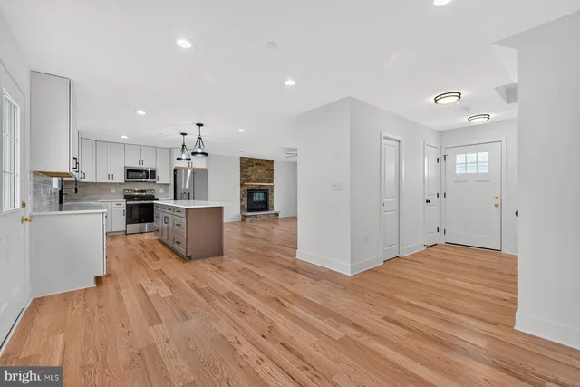 a view of kitchen with wooden floor