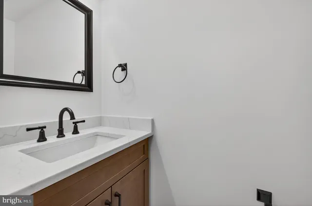 a bathroom with a sink and mirror