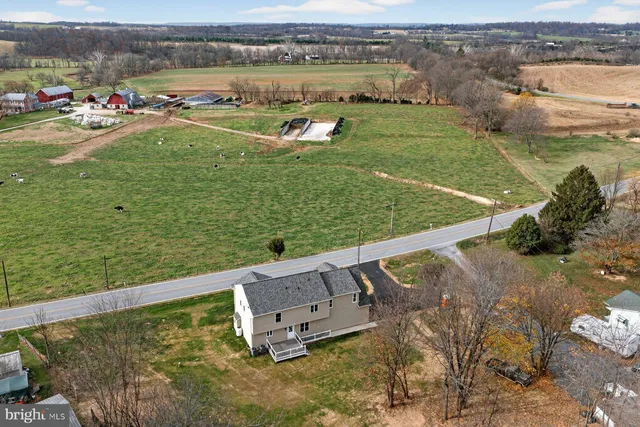 an aerial view of residential house with outdoor space