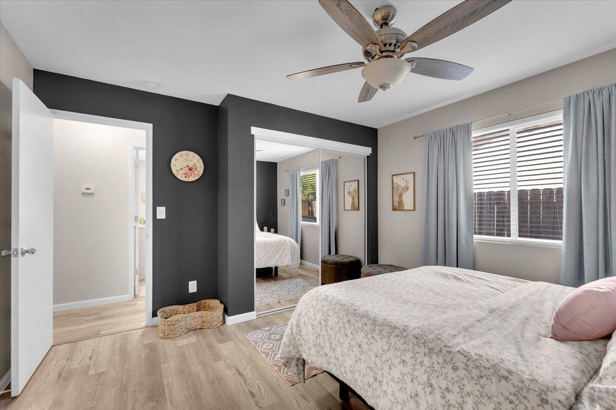 2110 Gentry Way Red Bluff, CA 96080 - Photo 18 of 47 a bedroom with a bed and a chandelier