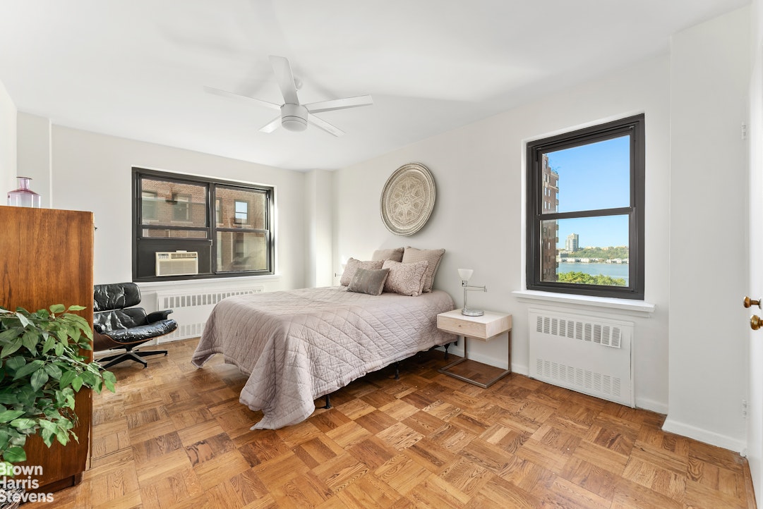 11 Riverside Drive, Unit 10PE Manhattan, NY 10023 - Photo 4 of 15 a bedroom with a bed and a window
