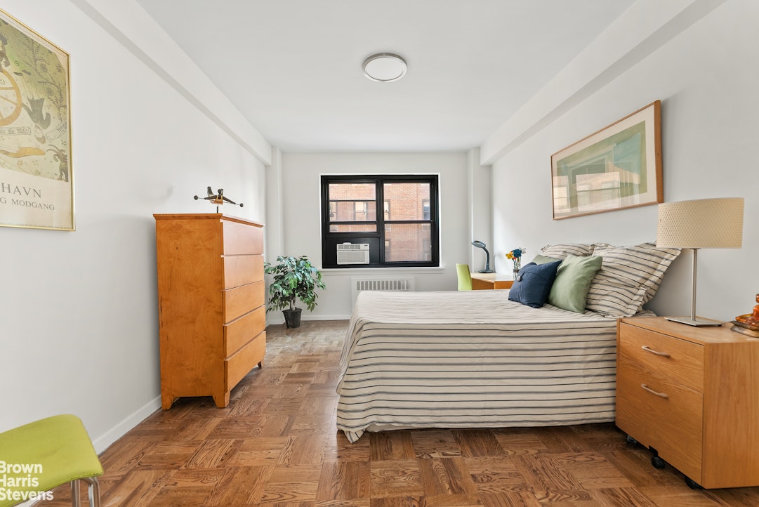 11 Riverside Drive, Unit 10PE Manhattan, NY 10023 - Photo 5 of 15 a bedroom with a bed and a couch